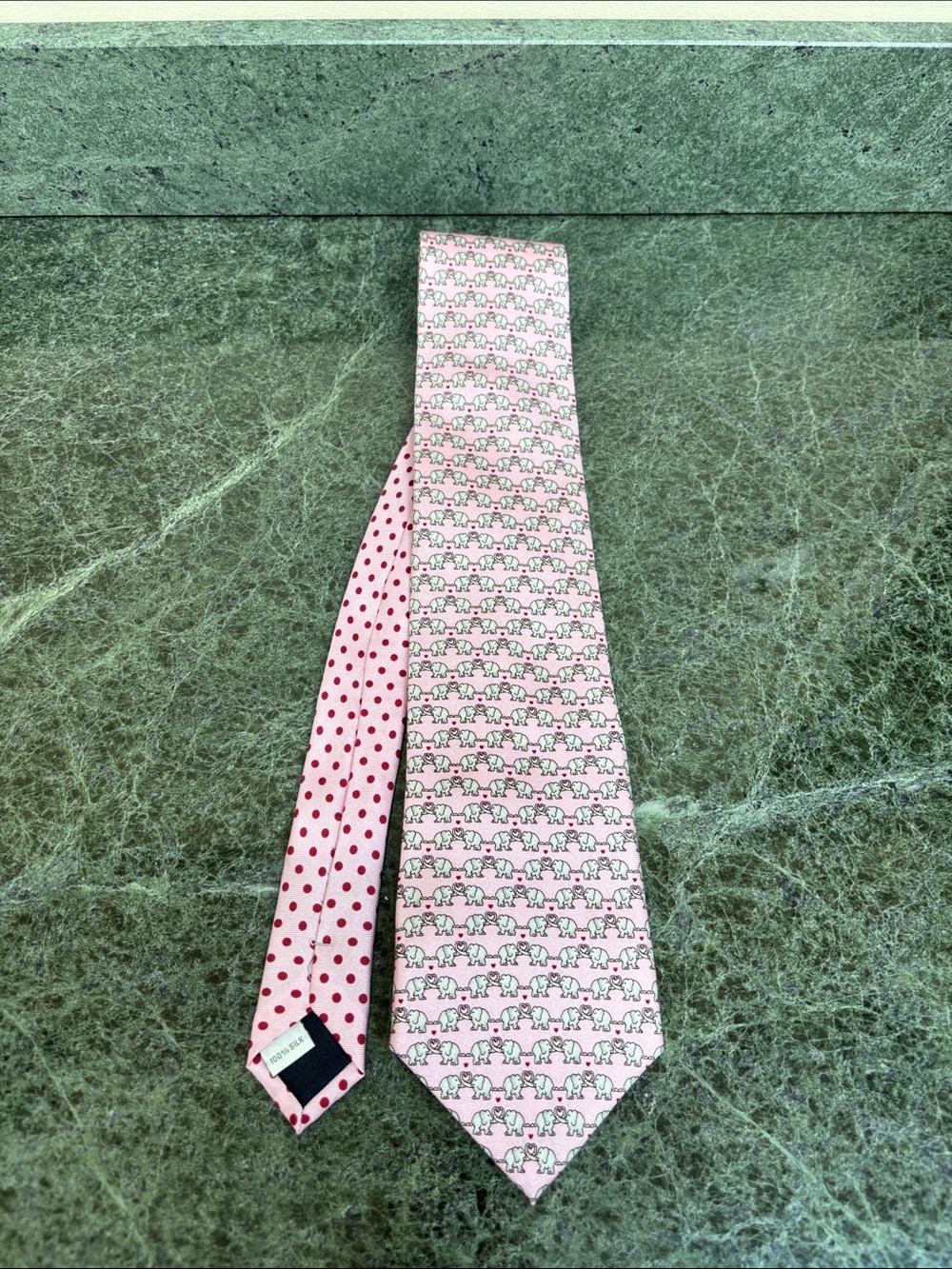 Pierre Cardin branded tie with a whimsical elephant and polka dot pattern.
